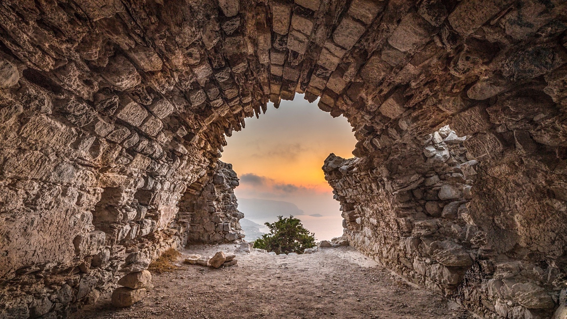 1920x1080 nature landscape stones cave tunnel rock trees mountain sea clouds sunset mist wallpaper JPG 910 kB