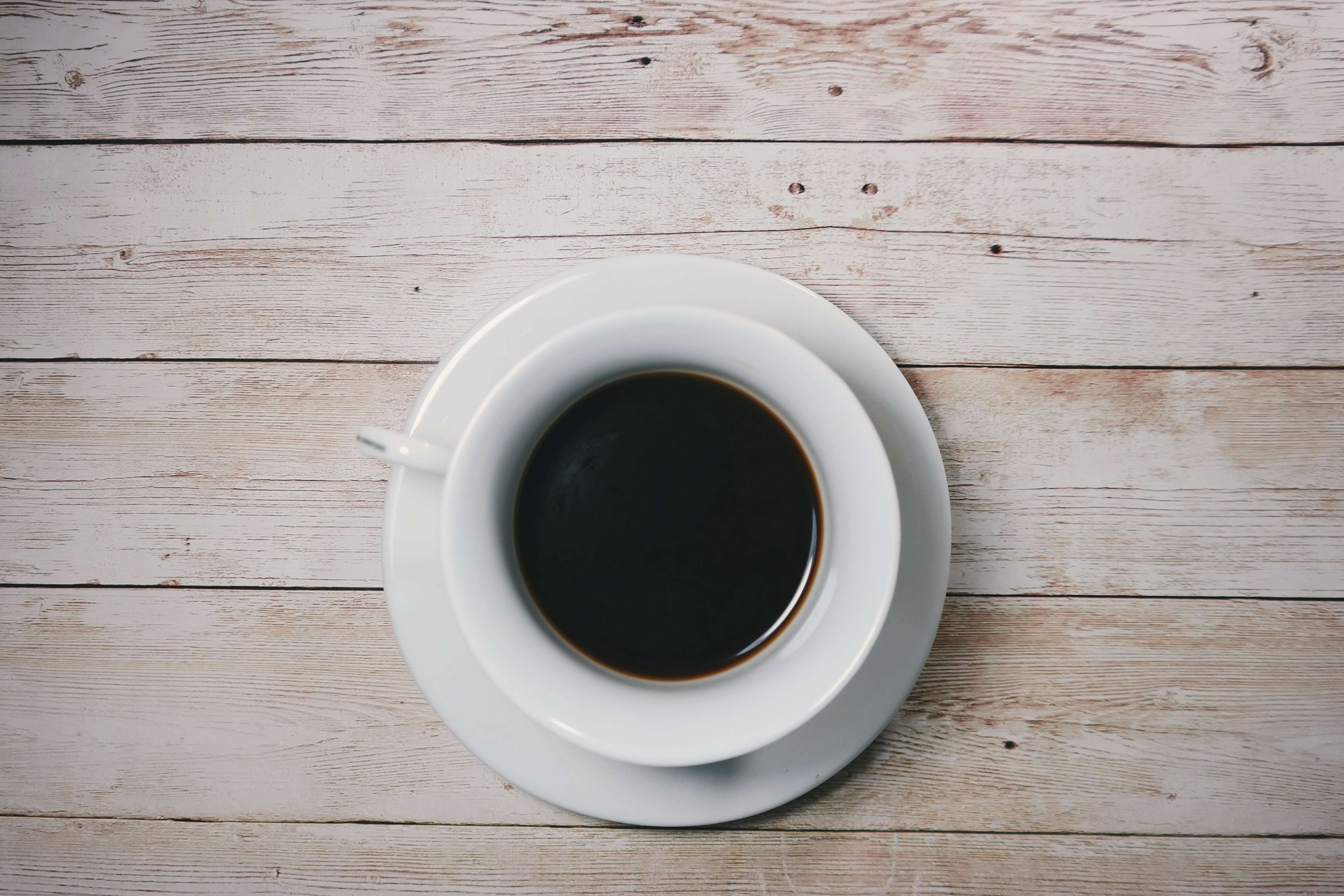 beverage, black coffee, caffeine, coffee, cup, cup of coffee, drink, espresso, hot, saucer, table, top view, wood, wooden planks, wooden table 4k wallpaper